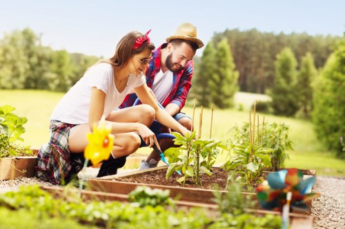 Professional landscapers planning a Brentcross garden redesign