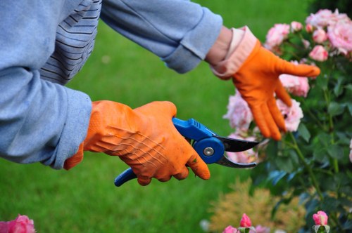 Landscapers Brentcross team managing sorted green waste for recycling